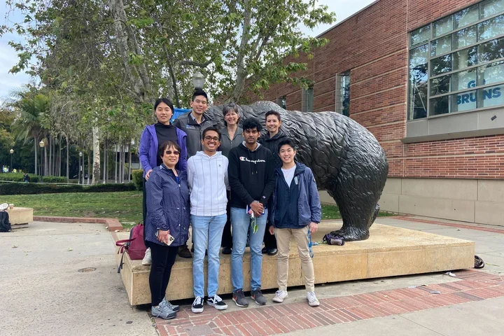 Lab members standing in front of a UCLA bruin statue.