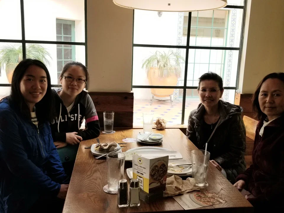 Four Lab members finishing up a meal at an indoor restaurant.