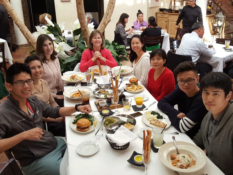 Lab members enjoying a meal together in a restaurant.