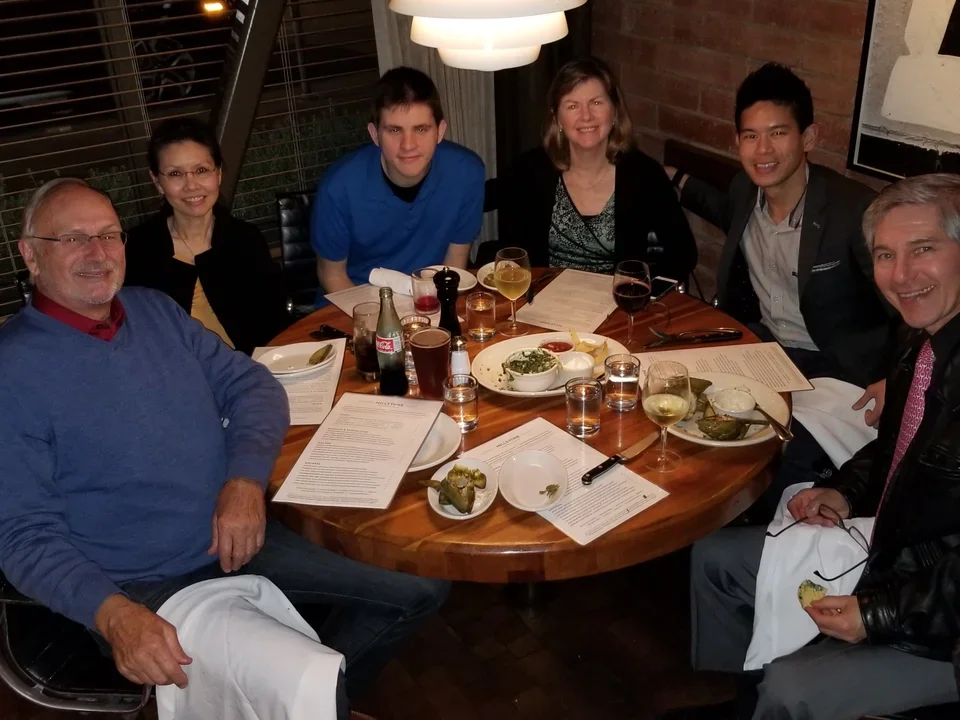 Lab members sitting together at a round table at a retaurant.