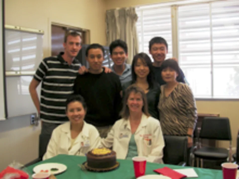 CVVRL lab members posing together at table. 