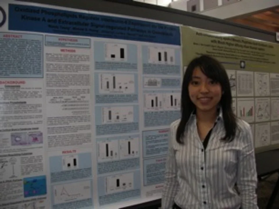 Wendy, member of CVVRL, standing in front of a research poster.